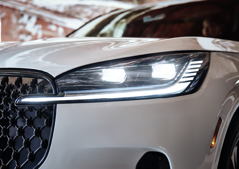 A close-up of a headlamp on the 2025 Lincoln Aviator® SUV is shown. | Friendly Lincoln in Monroe MI