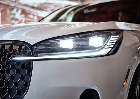 A close-up of a headlamp on the 2025 Lincoln Aviator® SUV is shown. | Friendly Lincoln in Monroe MI