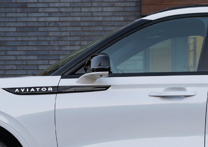 The driver’s door of a white 2025 Lincoln Aviator® SUV is showcased. | Friendly Lincoln in Monroe MI