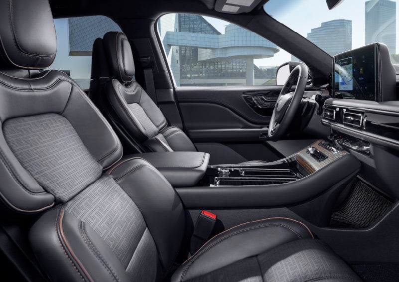 The interior of the 2025 Lincoln Aviator® SUV is shown with sleek black accents. | Friendly Lincoln in Monroe MI