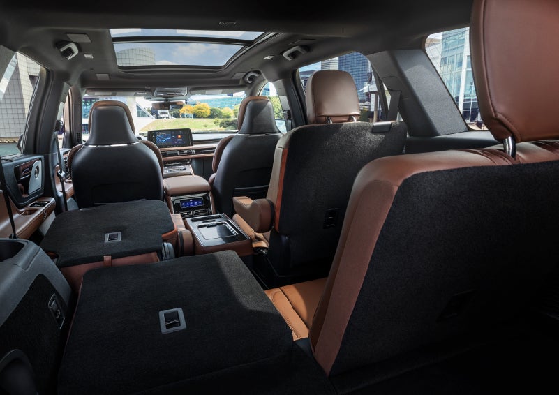 The interior of the 2025 Lincoln Aviator® SUV is shown with two seats folded down for added space. | Friendly Lincoln in Monroe MI