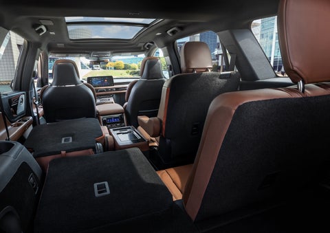 The interior of the 2025 Lincoln Aviator® SUV is shown with two seats folded down for added space. | Friendly Lincoln in Monroe MI