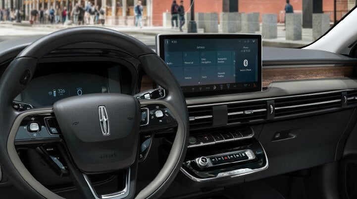 The center screen of the new 2025 Lincoln Corsair® SUV is showcased with its SYNC® 4 capabilities highlighted | Friendly Lincoln in Monroe MI