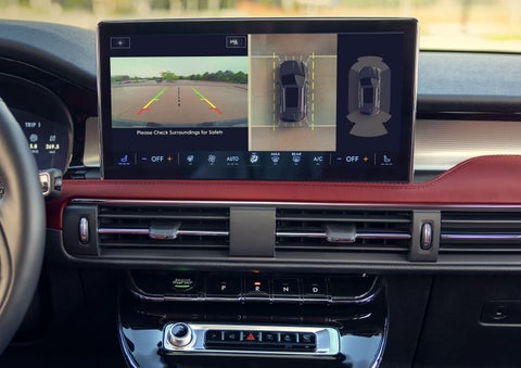 The driver of a 2024 Lincoln Corsair® SUV is shown selecting the drive mode. | Friendly Lincoln in Monroe MI
