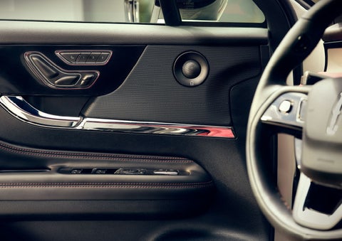 The driver of a 2024 Lincoln Corsair® SUV is shown selecting the drive mode. | Friendly Lincoln in Monroe MI