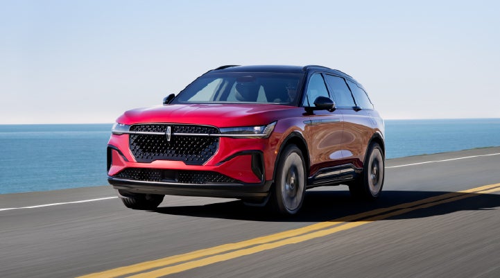 A 2025 Lincoln Nautilus® SUV is being driven on a seaside roadway. | Friendly Lincoln in Monroe MI
