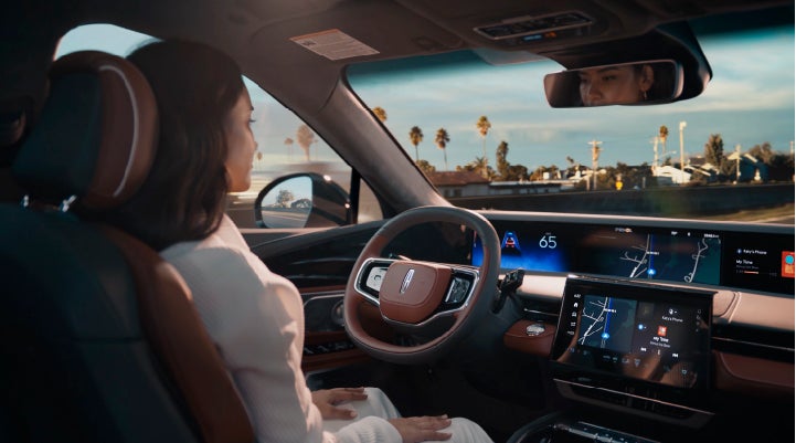 A person is shown driving hands-free on the highway with available Lincoln BlueCruise technology. | Friendly Lincoln in Monroe MI