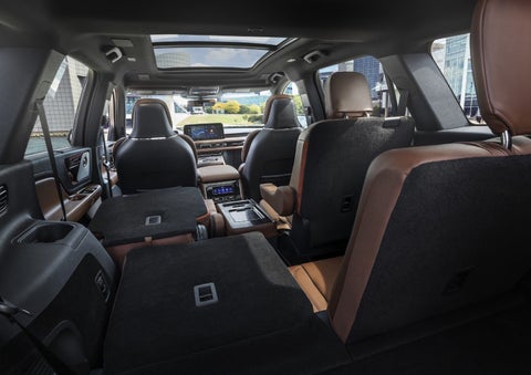 One side of the PowerFold® third-row seat and a second-row seat are folded forward in the 2026 Lincoln Aviator® SUV. | Friendly Lincoln in Monroe MI