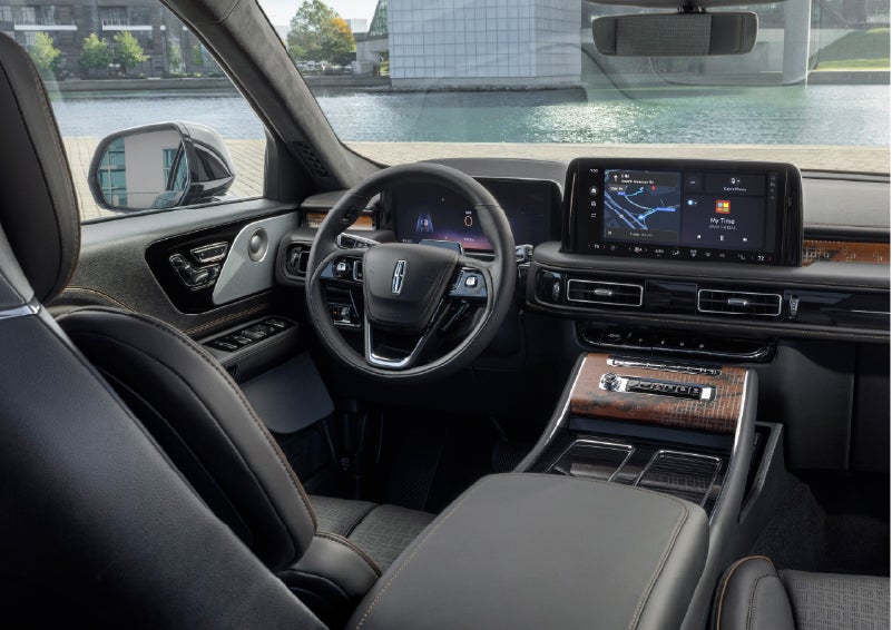 The interior of the 2026 Lincoln Aviator® SUV is shown parked with a view of a harbor through the windshield. | Friendly Lincoln in Monroe MI