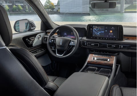 The interior of the 2026 Lincoln Aviator® SUV is shown parked with a view of a harbor through the windshield. | Friendly Lincoln in Monroe MI