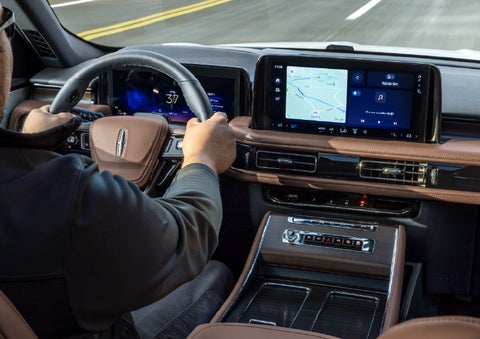 A person is driving a 2026 Lincoln Aviator® SUV as seen from inside the cabin. | Friendly Lincoln in Monroe MI