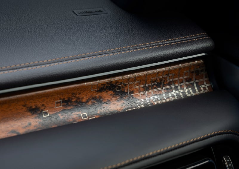 A close-up shot of the 2026 Lincoln Aviator® dashboard with unique black and brown accents and brown stitching. | Friendly Lincoln in Monroe MI