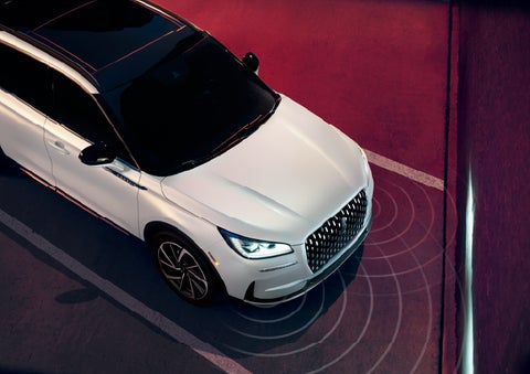 Simulated radar signals are shown emitting from the front of a 2026 Lincoln Corsair® SUV. | Friendly Lincoln in Monroe MI