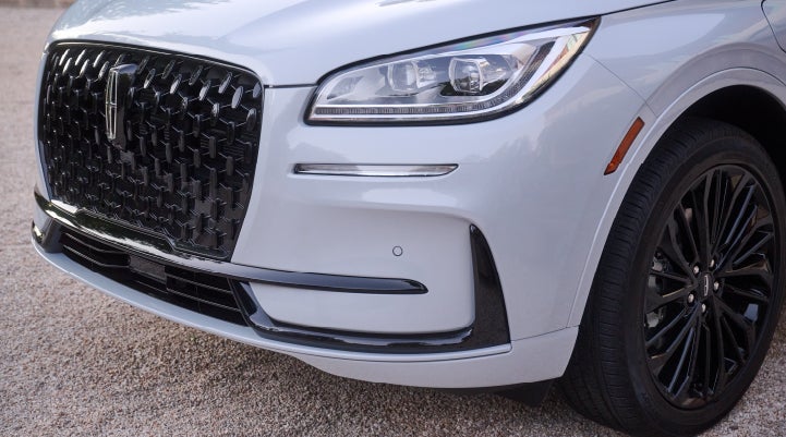 The all-black grille of the available Jet Appearance Package on a 2026 Lincoln Corsair® SUV is shown. | Friendly Lincoln in Monroe MI