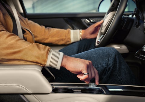 The driver of a 2026 Lincoln Corsair® SUV is shown selecting a drive mode. | Friendly Lincoln in Monroe MI