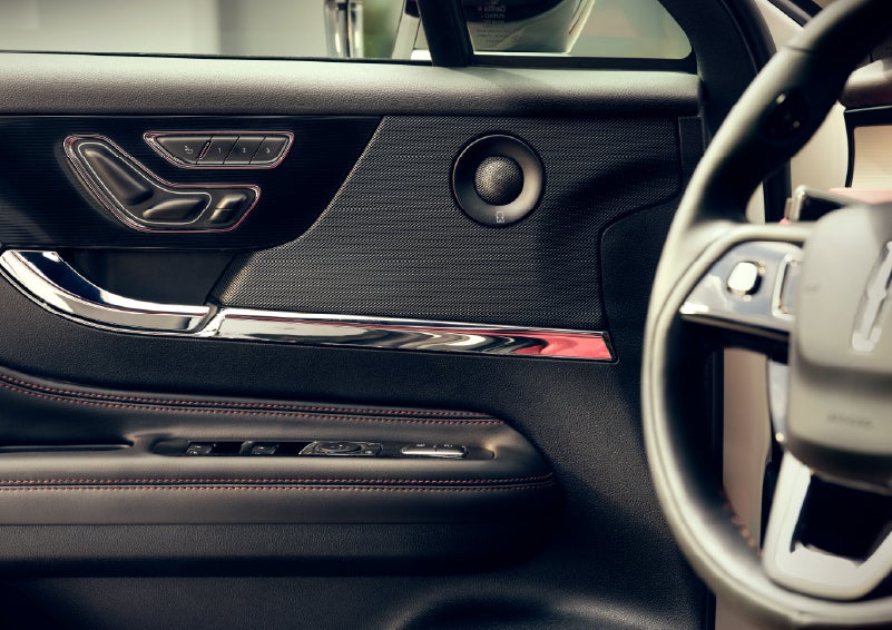 An audio speaker is shown in the driver's side door of a 2026 Lincoln Corsair® SUV | Friendly Lincoln in Monroe MI