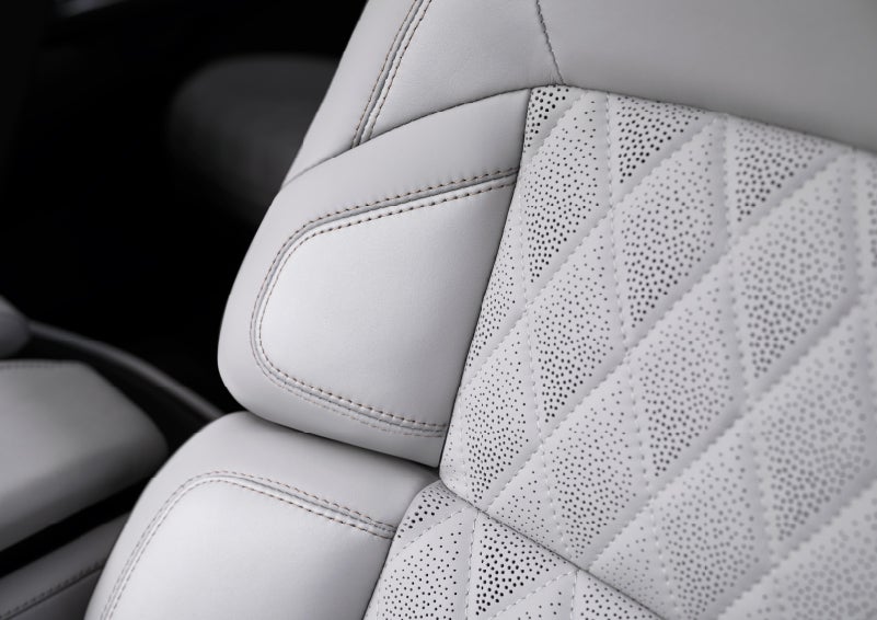 The front seats of a 2027 Lincoln Navigator® Black Label™ SUV in the Atmospheric theme feature quilted seat inserts.